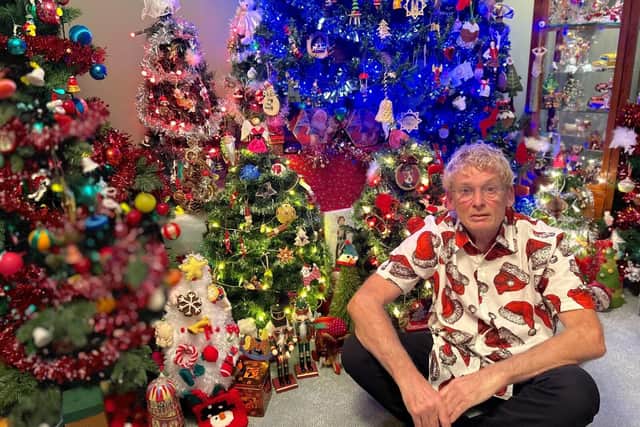 Geoff and 11 of his Christmas trees
