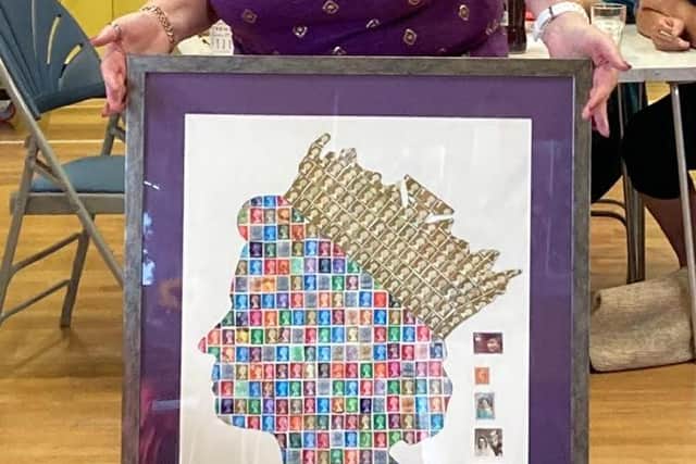 Southwater WI President Jackie Pearce with the finished article - the Queen of Stamps