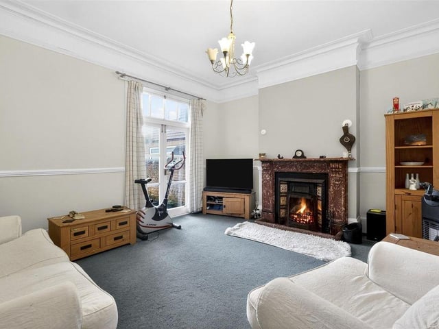 The sitting room has a door out to the back garden