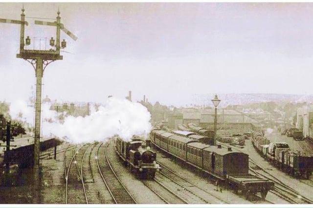 Steam train leaving Eastbourne railway station