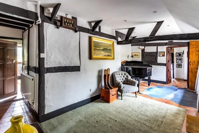 The property has many classic period features like exposed beams and whitewashed plaster walls, wood panelled latched doors and iron framed windows.