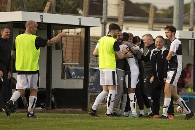 The East Preston bench celebrate after their first goal against Selsey | Picture: Chris Hatton
