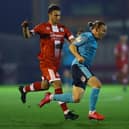 Nick Tsaroulla of Crawley Town tackles Matt Jay of Exeter City during the  League Two match at Broadfield Stadium on October 19, 2021 in Crawley, England. Picture by Bryn Lennon/Getty Images