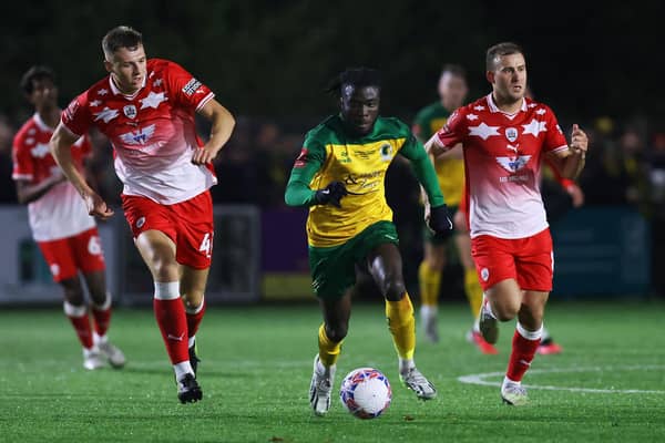 Daniel Ajakaiye of Horsham runs with the ball during the Emirates FA Cup First Round Replay match between Horsham and Barnsley at The Camping World Community Stadium on November 14, 2023 in Horsham, England. (Photo by Charlie Crowhurst/Getty Images)