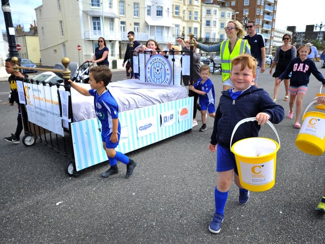 Worthing United Youth Football Club’s 30 teams took turns to push a bed along Worthing seafront to raise money for Chestnut Tree House
