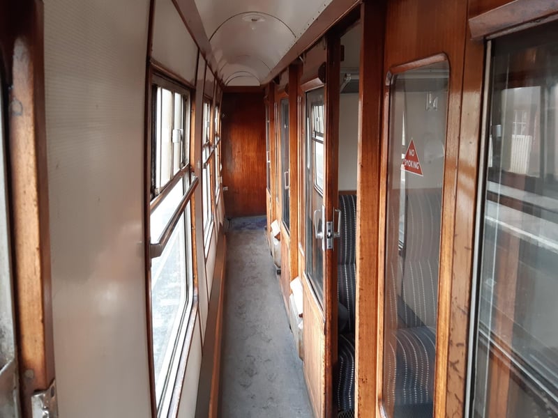 A vintage interior of a train on the The Bluebell Railway