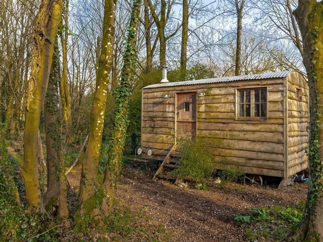 There are two greenhouses, one newly installed, and a shepherd's hut