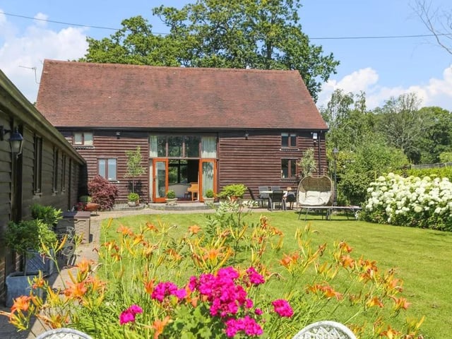 This five bed converted barn in Anmore Road, Denmead is on the market for £1.4m. It is listed on Zoopla by White & Guard Estate Agents.