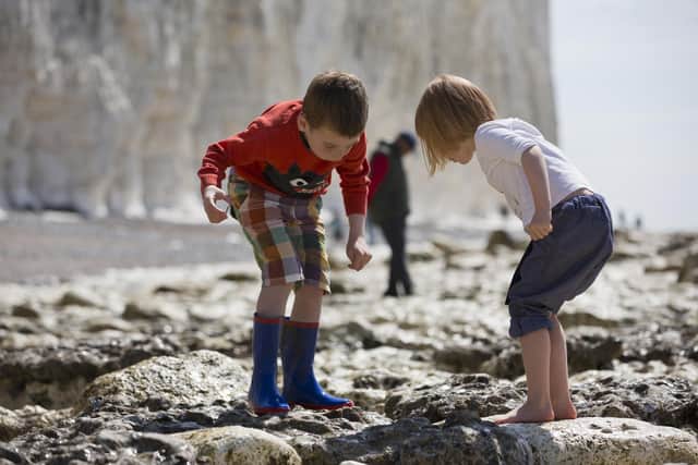 Children playing on the beach at Birling Gap, East Sussex.