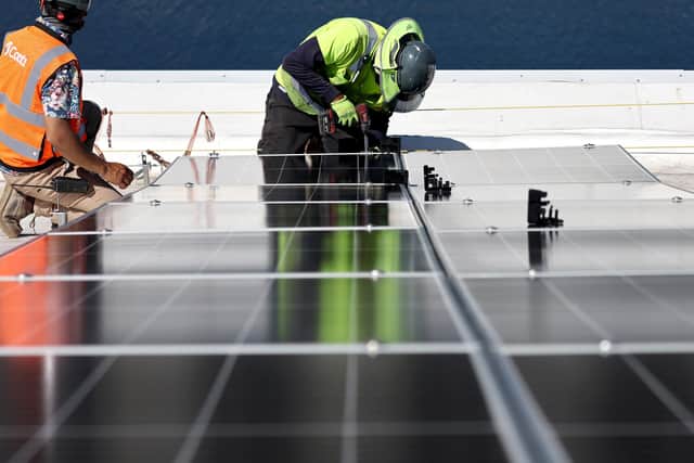 Solar panels being installed (Photo by Mario Tama/Getty Images)