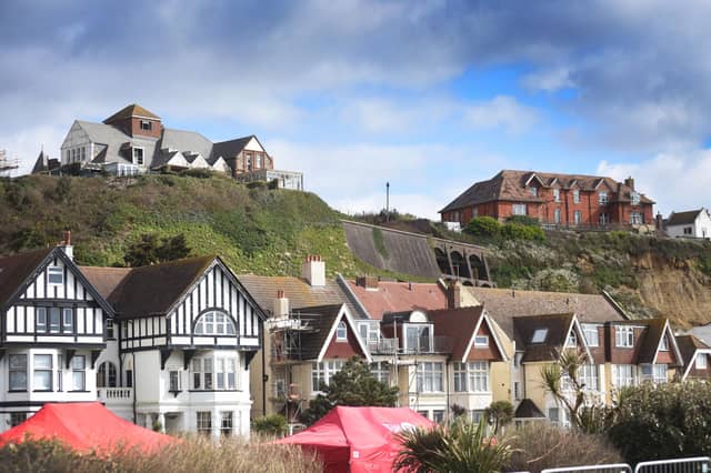 View of the old Eversfield Chest Hospital (building on the left at the top of the cliff) and to the right of it is the old Gambier House building.