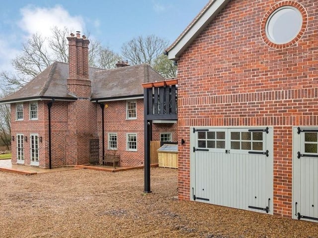 There is a large detached four-car garage currently being used as a gym
