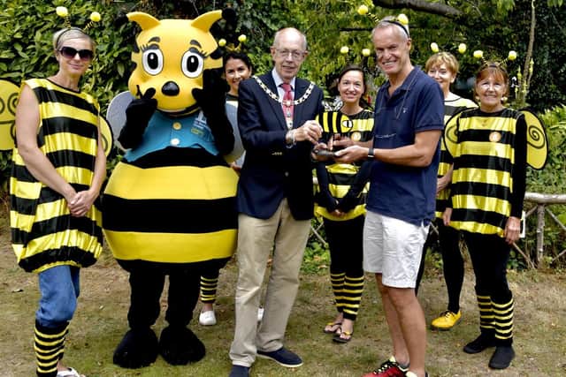 Arundel mayor Tony Hunt presents Nick Field with the Bee Friendly Town Award