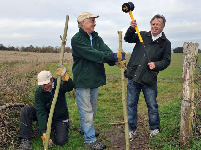 Pete Varkala, Roger Brown and David Barling trying out new tools that were bought with a West Sussex County Council grant in 2013