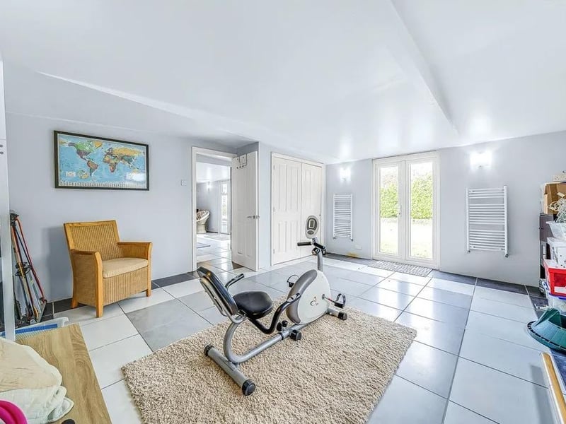 The games room and gym area spans about 55 feet