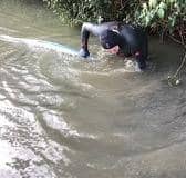 After being swamped by floodwater for weeks, Paul Maggs donned a wetsuit and tried to clear the water himself from outside his home in West Chiltington