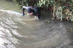After being swamped by floodwater for weeks, Paul Maggs donned a wetsuit and tried to clear the water himself from outside his home in West Chiltington