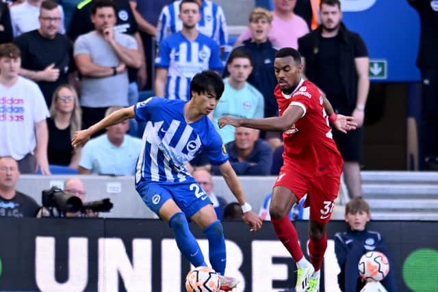 BRIGHTON, ENGLAND - OCTOBER 08: (THE SUN OUT, THE SUN ON SUNDAY OUT) Ryan Gravenberch of Liverpool competing with Kaoru Mitoma of Brighton and Hove Albion during the Premier League match between Brighton & Hove Albion and Liverpool FC at American Express Community Stadium on October 08, 2023 in Brighton, England. (Photo by Andrew Powell/Liverpool FC via Getty Images)