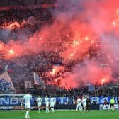 Marseille's supporters light flares prior to the French L1 football match at Olympique de Marseille