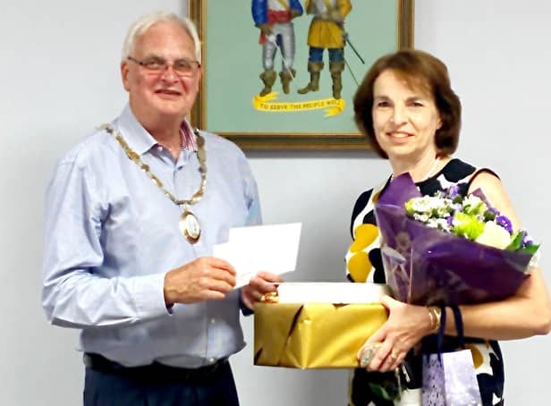 Haywards Heath town mayor Howard Mundin Mayor presents flowers and gifts to Helen Hewitt