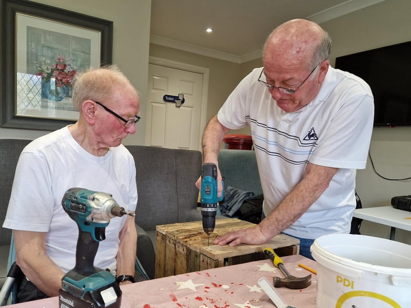 Jim Cox, left, working with Jim Dumbrell on a tortoise house