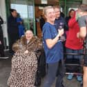 Lynn and Chris Allen welcomed by blind veterans at Rustington after their run from Peacehaven.
