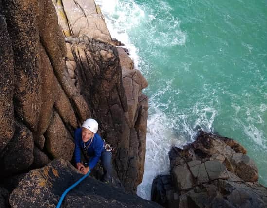Woppy Keeling training for her climb at Baggy Point in North Devon