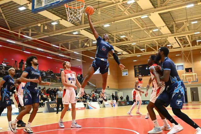 Ronald Blain leaps to score for Worthing Thunder against Solent Kestrels | Picture: Gary Robinson