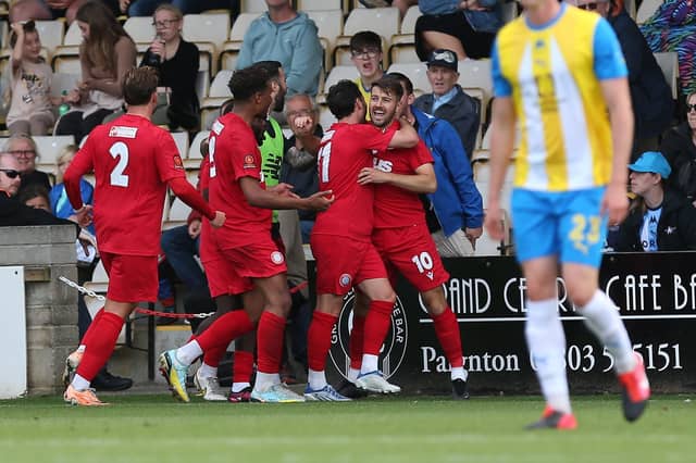 Action from Worthing's 3-0 win at Torquay United which put them top of National League South