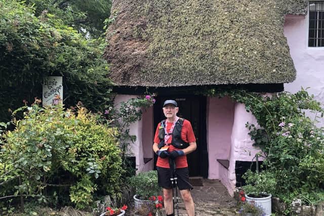 Mark pausing from his run outside Rose Cottage, where his father had lived during the war