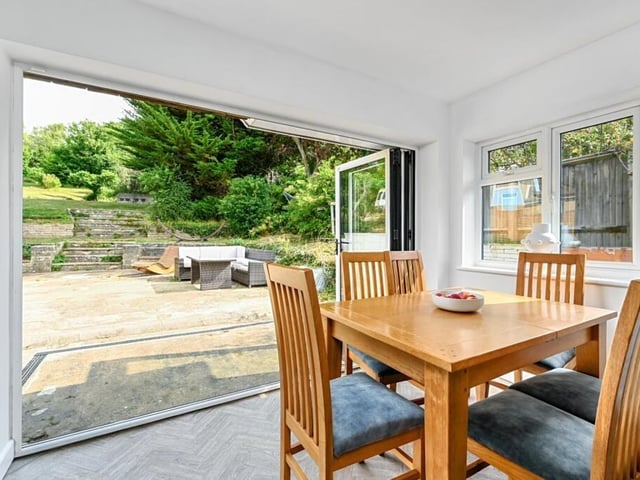 The dining room opens out onto the garden