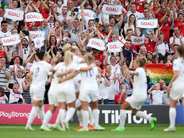 England fans celebrate after their side's third goal.