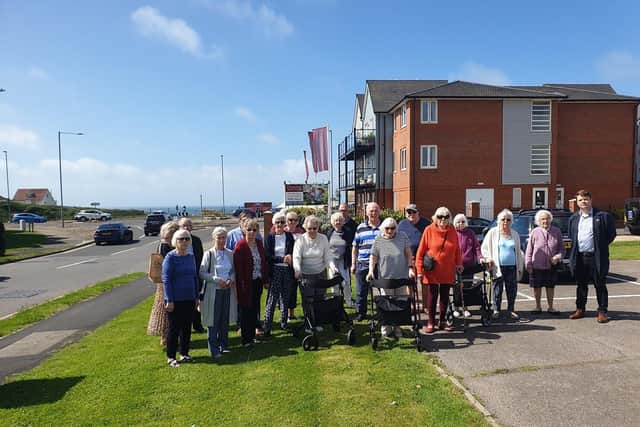 Councillor Ciarron Clarkson (right) with Jill Fry Secretary Peacehaven, Telscombe Cliffs and East Saltdean Access group (fifth from right) and residents of Neville Lodge on Sutton Avenue.