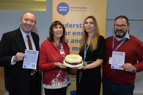 Councillor Michael Jones with Councillor Sue Mullins, who baked and presented a celebration cake to Emma Cross (CEO CAWS) and Jason Mather (Head of Client Services, CAWS) (Photo by Jon Rigby)