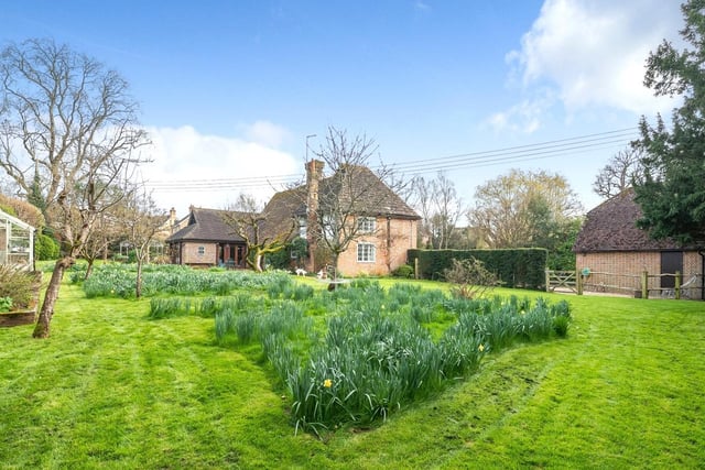 There is a lovely, secluded rear garden with a babbling brook, a feature pond with a cascading waterfall and -  for more historical interest -  a Grade II listed outhouse