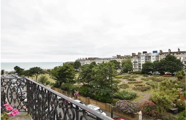The flat has a balcony overlooking the sea and Warrior Square gardens
