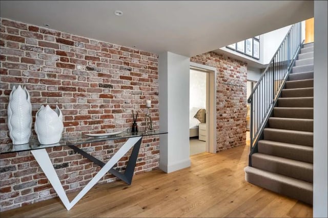 Exposed brick and steel support gives the property character and charm.