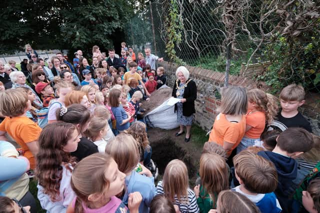 Councillor Shirley-Anne Sains, mayor of Lewes, buried a time capsule containing messages and drawings made by children in every school year.