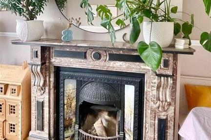 The lounge has a marble fireplace