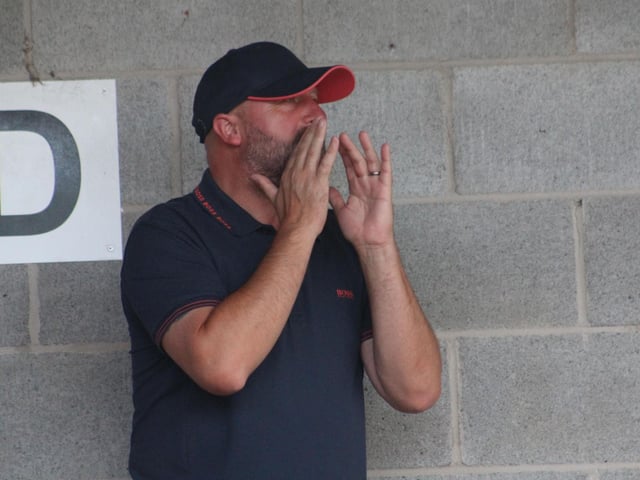 A fan shouts his support against AFC Wimbledon