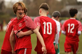 Lewis Rustell (facing) celebrates with team mates after putting Bosham 1-0 up against Rotherfield on the way to a 4-1 victory in the Intermediate Cup | Picture: Chris Hatton - see more pics by Chris in the slideshow in the video player above