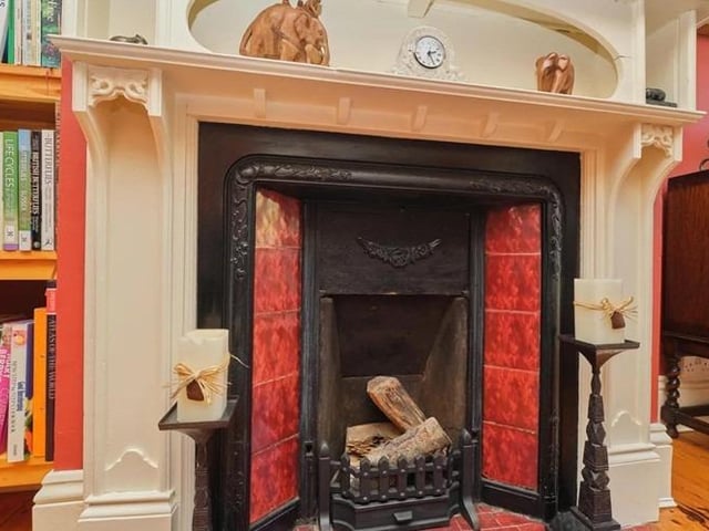 The living room is bright and airy, boasting wooden flooring, gas fire with stunning original cast iron surround, original picture rails and bay window.