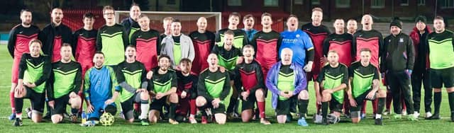 The reds and greens lined up as a guard of honour was bestowed upon those who had sadly lost love ones to cancer