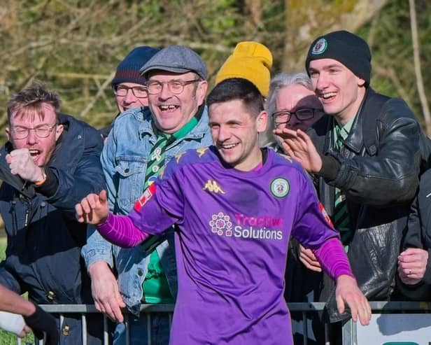 Burgess Hill Town celebrate on the way to winning at East Grinstead Town | Picture: Chris Neal
