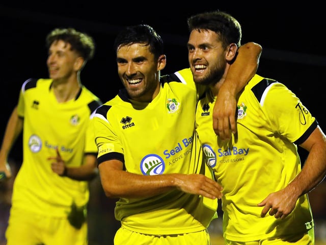 Selsey players celebrate with Sam Conolley after he scores Selsey's second goal