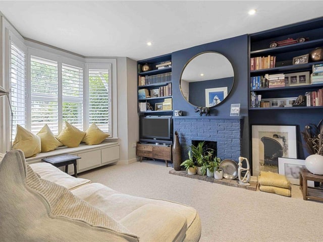 The open fireplace is more evidence of the property's Victorian roots