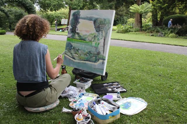 Painting student in West Dean Garden with tutor Matthew Collings