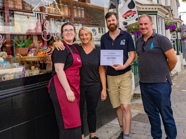 Sam from Rushfields Plant Centre and Russell Barnes, chair of Steyning & District Business Chamber, present the second place prize to The Little Sweetshop