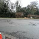 Cone and potholes in Rectory Lane