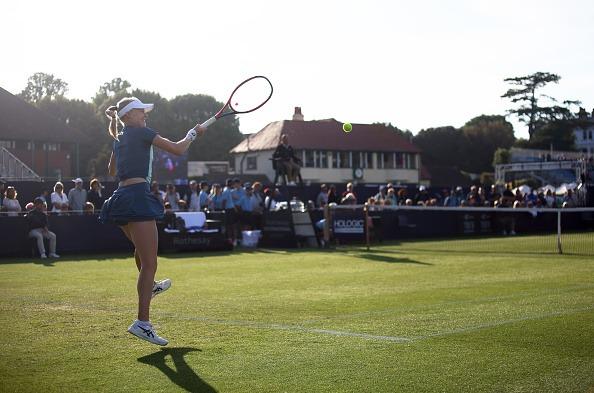 Harriet Dart of Great Britain plays a forehand during their match against Jil Teichmann of Switzerland during Day Four